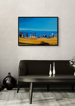 Above Rhodes Town by Nella Hajdu framed above a dark sofa beside a candlestick and a vase