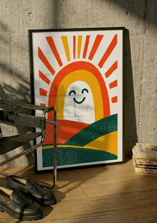 Sunrise Arch by Decker Studios in a black frame leaning against a concrete wall by a steel chair