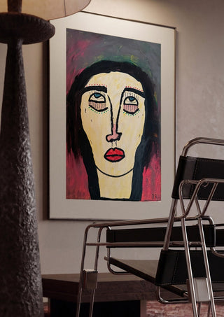 Rock n Roll by RR framed in a dim room beside a tubular steel chair