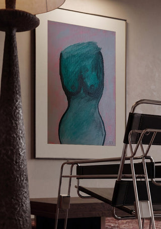 Kroppen by RR framed in a dim room beside a tubular steel chair