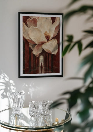 Magnolia in the Hall by Matthews Gallerie in a black frame above a glass table with crystal glassware