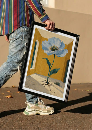 The Room That Bloomed by Matthews Gallerie carried in a black frame along a sunny street