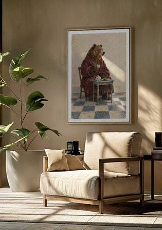 Tea Before Noon by Matthews Gallerie framed above a beige armchair beside a potted plant