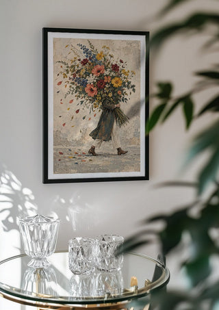 Carrying Spring by Matthews Gallerie in a black frame above a glass table with crystal glassware