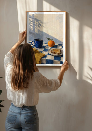 Blue Hour Breakfast by Matthews Gallerie being hung on a sunlit wall