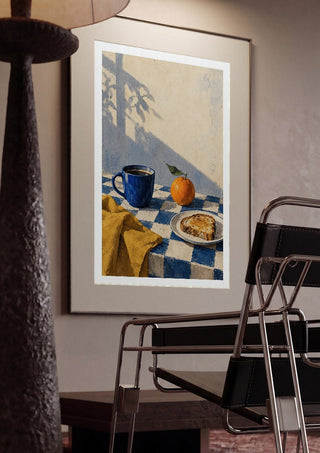 Blue Hour Breakfast by Matthews Gallerie framed in a dim room beside a tubular steel chair
