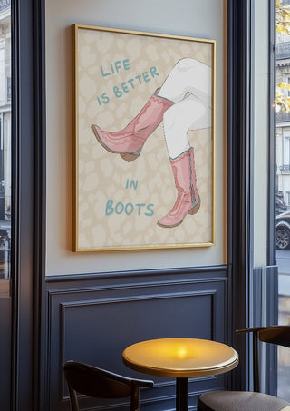 Life is better in boots by Lisen Vennesland in an oak frame on a panelled café wall