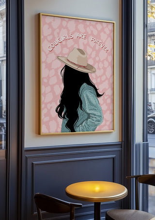 Cowgirls are forever by Lisen Vennesland in an oak frame on a panelled café wall
