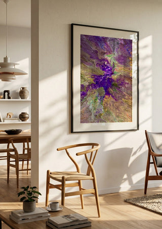 Violet Drift by Da Winters in a black frame in a bright dining room with wooden chairs