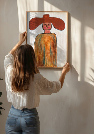 Cowboy by RR being hung on a sunlit wall