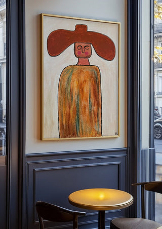 Cowboy by RR in an oak frame on a panelled café wall