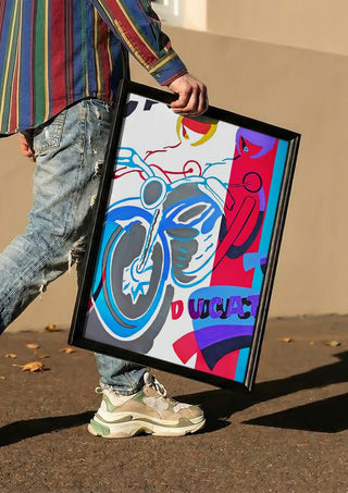 Homage to ducati by NKo carried in a black frame along a sunny street