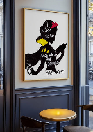 I Used to Be Snow White by Camilla Nilsson in an oak frame on a panelled cafe wall
