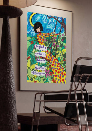 To Plant a Garden by Camilla Nilsson framed in a dim room beside a tubular steel chair