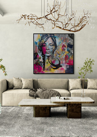 Ende des Sommers by Anke Fillies in a black frame above a beige sofa under a branch chandelier