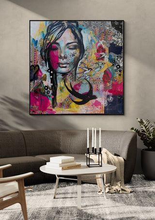 Ende des Sommers by Anke Fillies in a black frame above a grey sofa with candlesticks on a round table