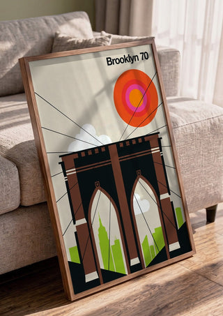 Brooklyn 70 by Bo Lundberg in a walnut frame leaning against a grey sofa