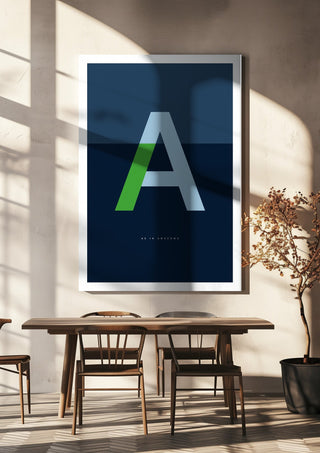 A as in Awesome – Blue by Quite Nice Prints hanging above a wooden dining table in warm sunlight