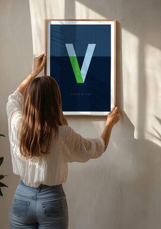 V as in Va-va-voom – Blue by Quite Nice Prints being hung on a sunlit wall