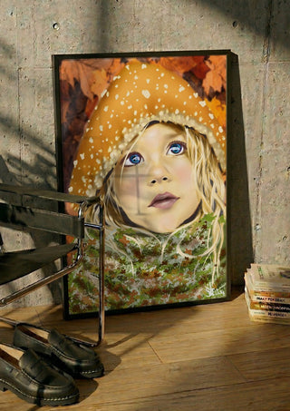 mushroom boy by Sofia de Lemos in a black frame leaning against a concrete wall by a steel chair