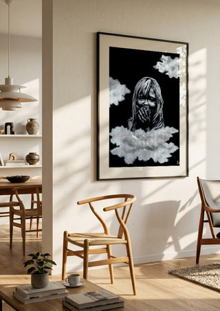 innocence by Sofia de Lemos in a black frame in a bright dining room with wooden chairs