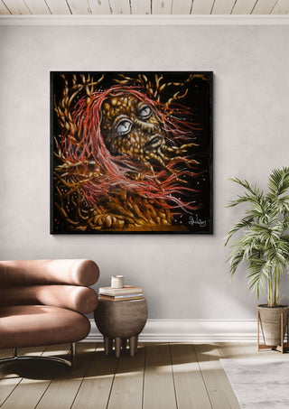 forest witch by Sofia de Lemos in a black frame on a pale wall beside a leather armchair and a palm