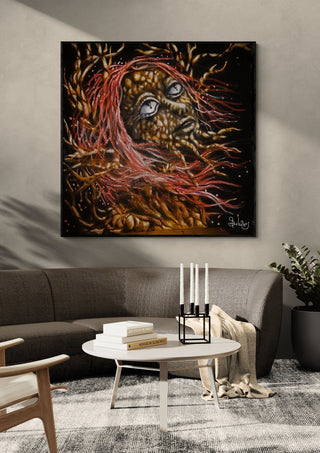forest witch by Sofia de Lemos in a black frame above a grey sofa with candlesticks on a round table