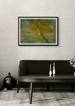 Tree in Gold Light by luco art in a black frame above a dark sofa with candlesticks and a vase