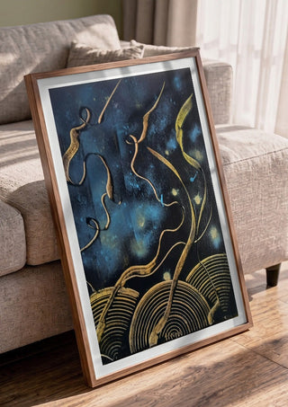 Gold Ribbons at Night by luco art in a walnut frame leaning against a grey sofa