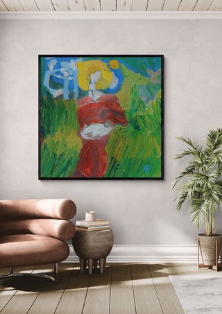The Woman in the Wheat by António D'Albuquerque in a black frame on a pale wall beside a leather armchair and a palm