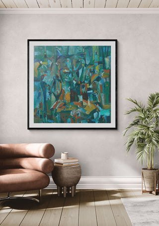 Forest of Figures by António D'Albuquerque in a black frame on a pale wall beside a leather armchair and a palm
