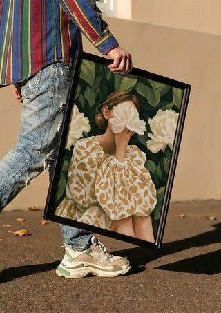 Behind the Peony by Martina Karlsson carried in a black frame along a sunny street