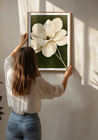 White Magnolia by Martina Karlsson being hung on a sunlit wall