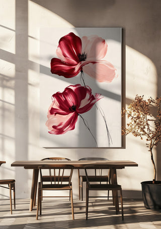 Crimson and Blush by Martina Karlsson hanging above a wooden dining table in warm sunlight