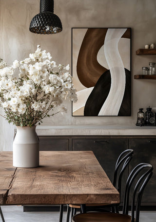 Dune and Shadow by Martina Karlsson in a black frame above a rustic table with white flowers