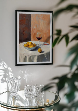 Summer scene: Lemons and wine by Ohkimiko in a black frame above a glass table with crystal glassware