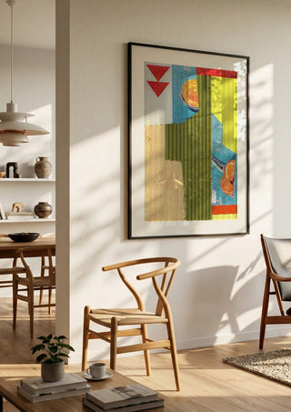 Peach & Mandarin by Kareem Rizk in a black frame in a bright dining room with wooden chairs