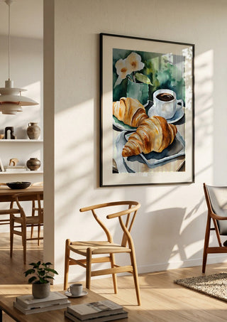 Petit dejeuner - coffee and croissants by Ohkimiko in a black frame in a bright dining room with wooden chairs