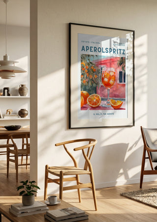 Il dolce far niente - Aperol by Ohkimiko in a black frame in a bright dining room with wooden chairs