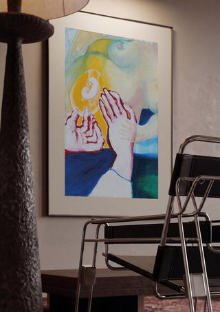 Between the Hands by António D'Albuquerque framed in a dim room beside a tubular steel chair