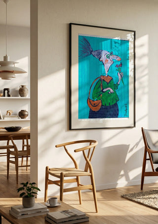 Mit spitzer Nase und weichem Kern by Trude in a black frame in a bright dining room with wooden chairs