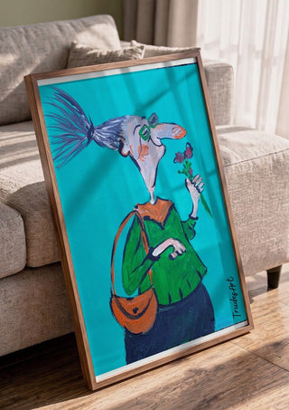 Mit spitzer Nase und weichem Kern by Trude in a walnut frame leaning against a grey sofa