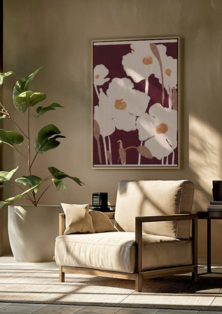 Abstract Flowers 10 by ThingDesign framed above a beige armchair beside a potted plant
