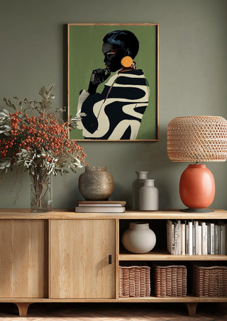 Form and Presence by ThingDesign above a wooden sideboard on a sage green wall
