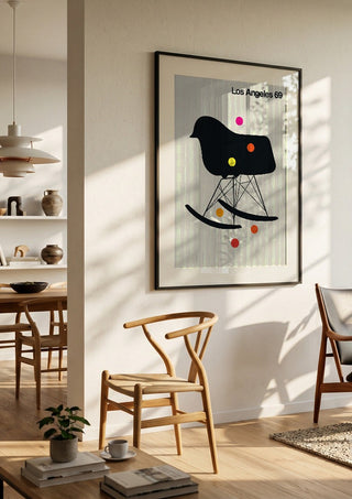 Los Angeles 69 by Bo Lundberg in a black frame in a bright dining room with wooden chairs