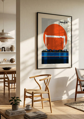Malmö 74 by Bo Lundberg in a black frame in a bright dining room with wooden chairs