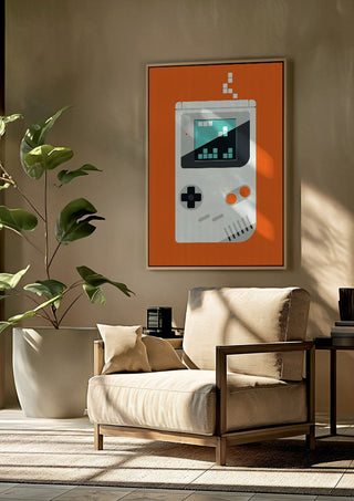 Playing games by Bo Lundberg framed above a beige armchair beside a potted plant
