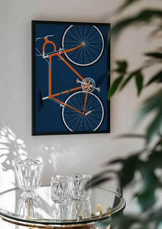 Swedish Racing Bike by Bo Lundberg in a black frame above a glass table with crystal glassware
