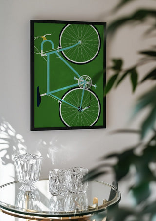 Italian Racing Bike by Bo Lundberg in a black frame above a glass table with crystal glassware
