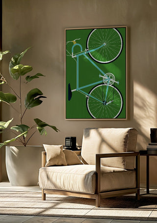 Italian Racing Bike by Bo Lundberg framed above a beige armchair beside a potted plant